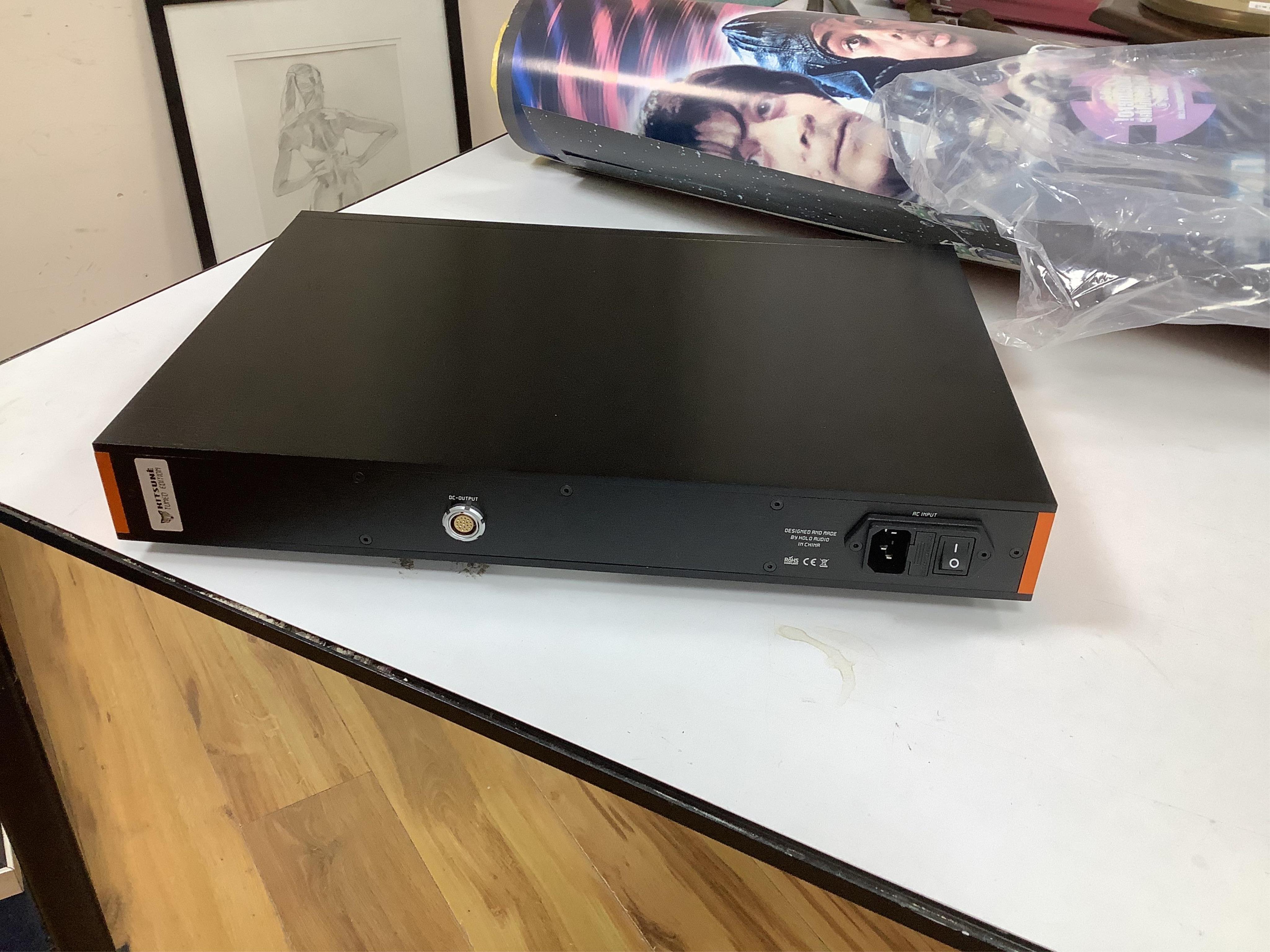 A Holo Audio May R2R digital analog converter (DAC) with linear compensation, contained within its original box and packaging, with owners manual, etc. Condition - good, appears unused. Sold untested.